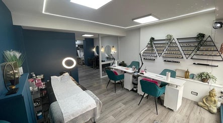 Modern beauty salon interior at Kreep Sherwood, Nottingham, England, GB, showcasing manicure stations and decor.
