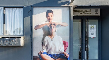 Exterior of Thammarat Thai Massage in Ponsonby, Auckland, NZ showing serene massage imagery on storefront.