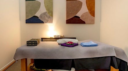 Cozy massage room at Thammarat Thai Massage in Ponsonby, Auckland, NZ with artistic decor.