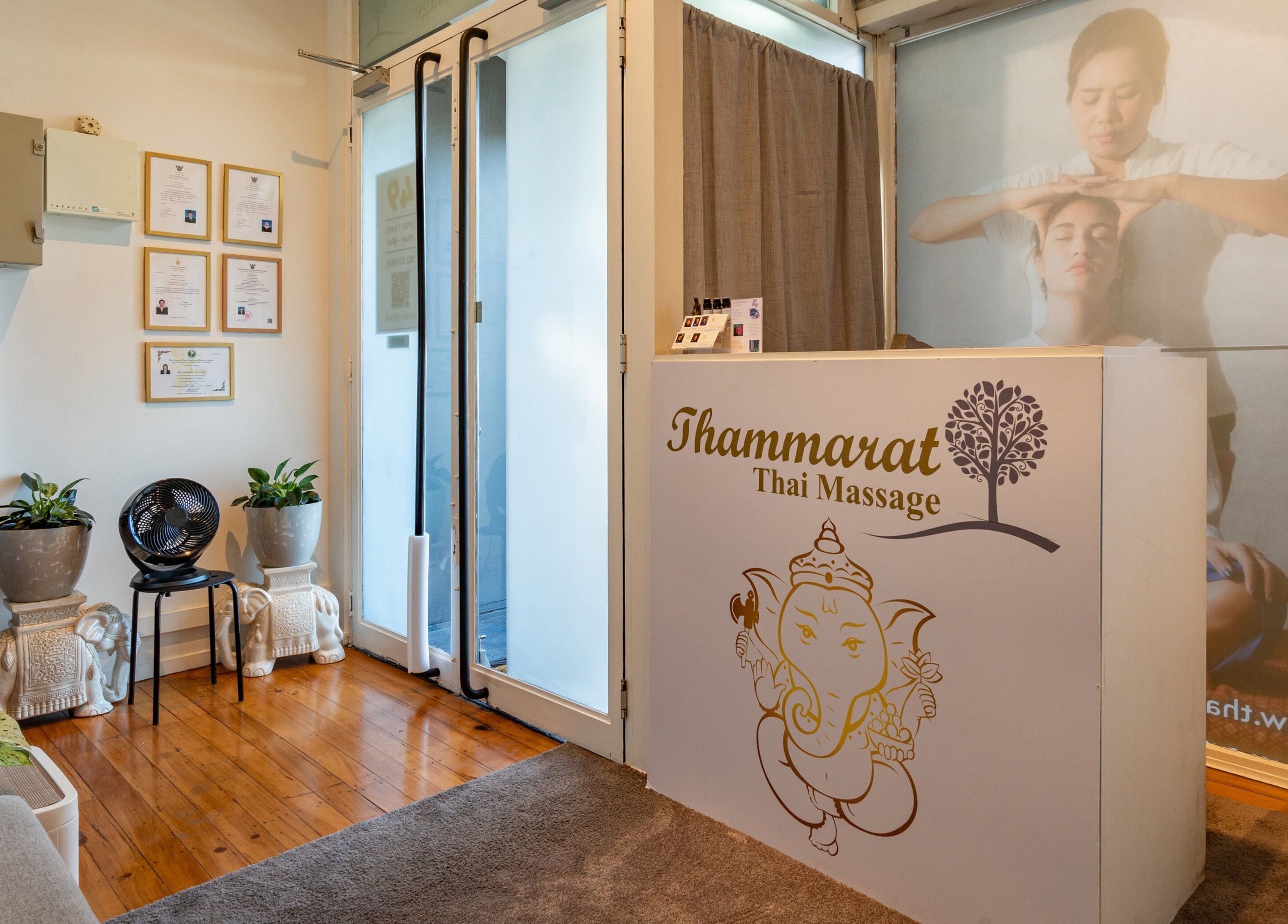 Reception area of Thammarat Thai Massage in Ponsonby, Auckland, NZ showcasing tranquil decor and certifications.
