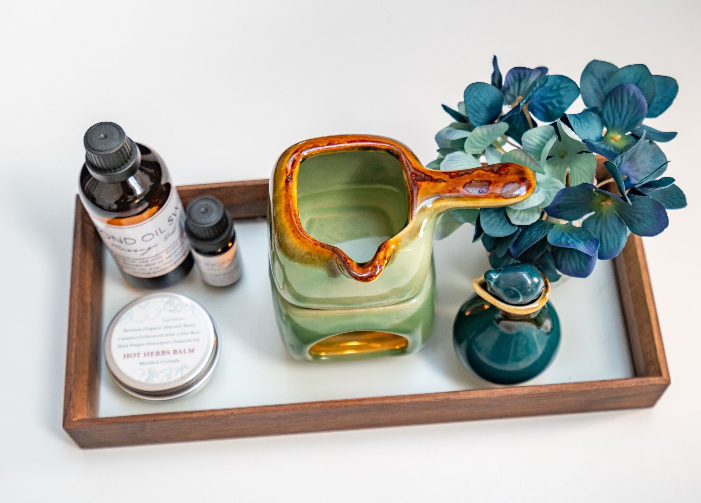 Aromatherapy setup at Thammarat Thai Massage in Ponsonby, Auckland, featuring oils and flowers for relaxation.