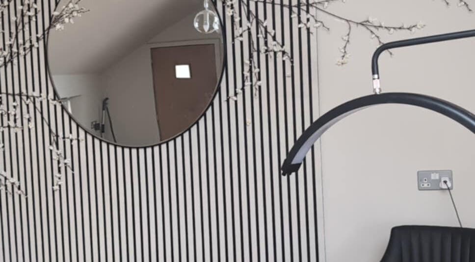 Modern salon corner at HW Beauty Axminster with chic decor and mirrors in Axminster, England, GB.