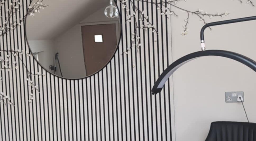 Modern salon corner at HW Beauty Axminster with chic decor and mirrors in Axminster, England, GB.