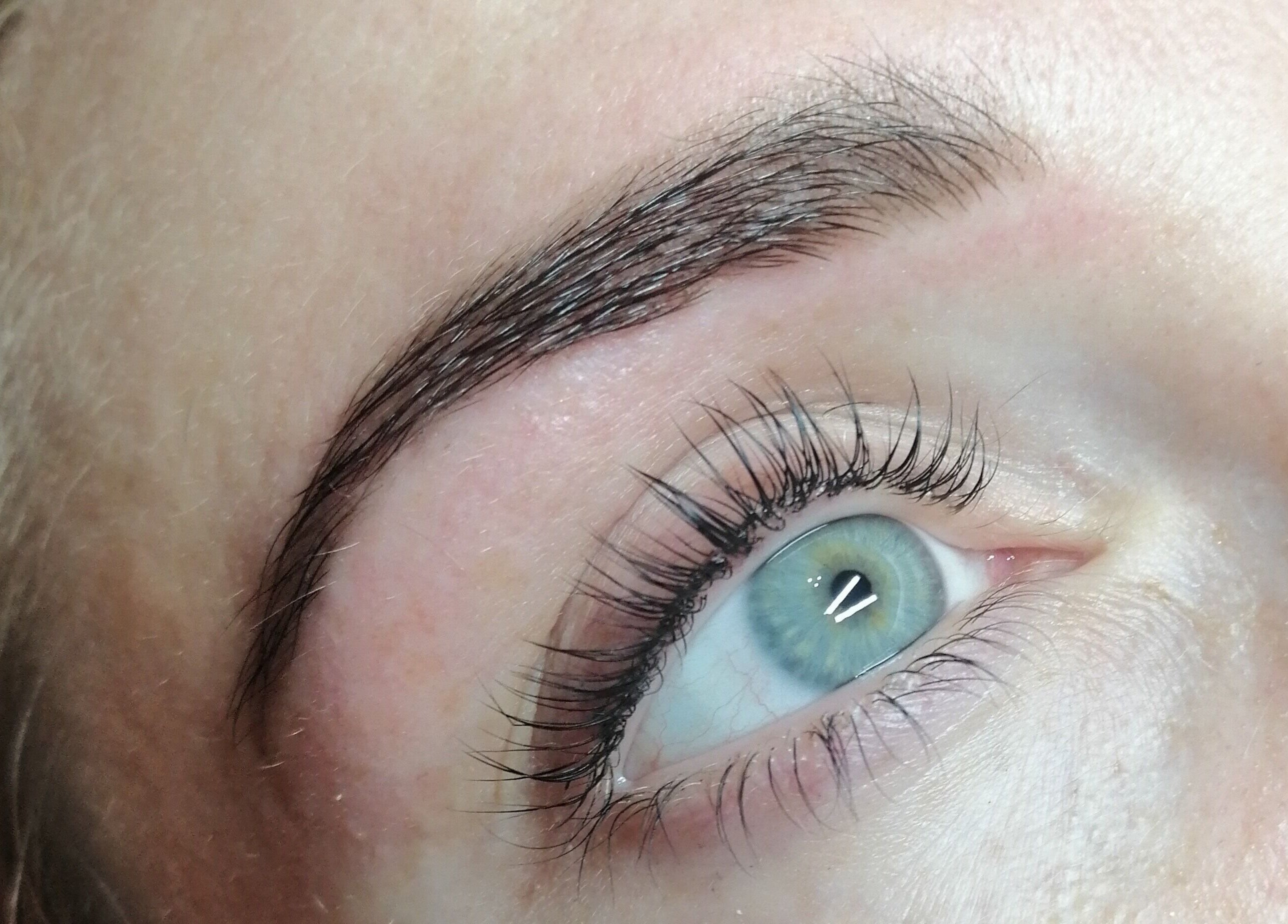 Close-up of perfectly groomed eyelashes at Fortuna Nails, Worthing, England, GB.