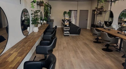 Stylish interior of Unique Creations for Hair in Australind, Western Australia, AU with elegant mirrors and seating.
