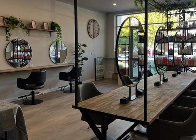 Spacious salon interior of Unique Creations for Hair in Australind, Western Australia, AU with modern decor.