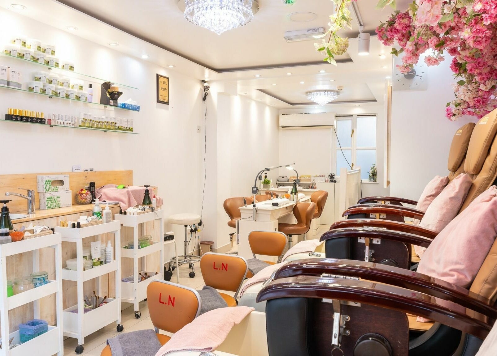 Serenity Earl's Court interior with floral decor, London, England, GB. Stylish nail and beauty salon setting.
