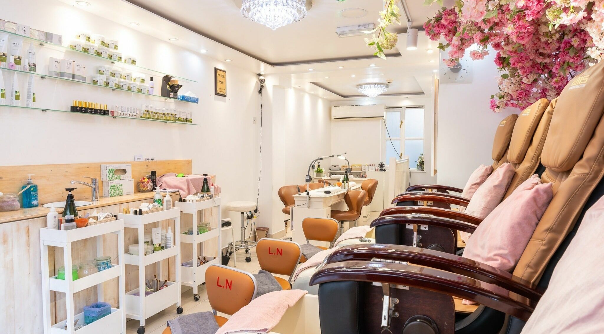 Serenity Earl's Court interior with floral decor, London, England, GB. Stylish nail and beauty salon setting.
