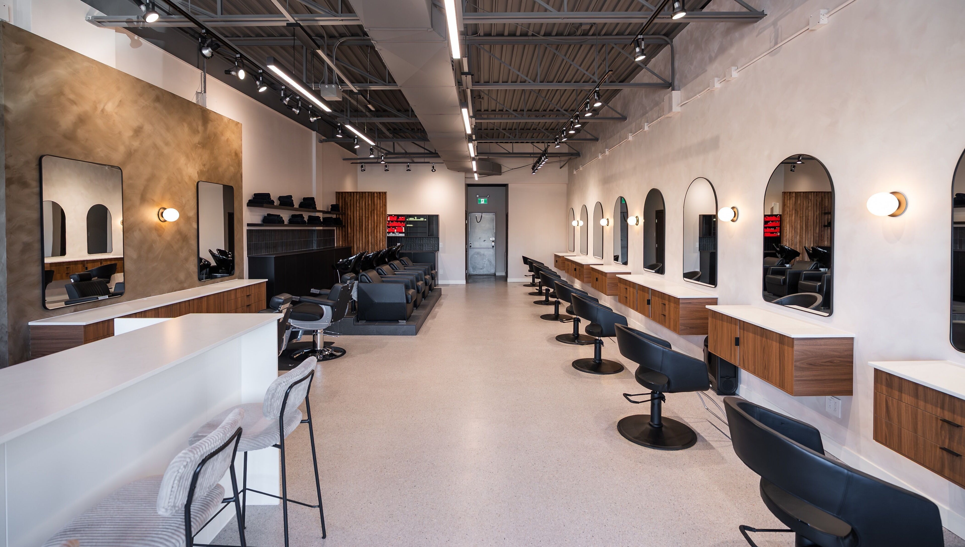 Modern styling stations inside In The Cut Salon, Montréal, Québec, CA, providing luxury hair services.