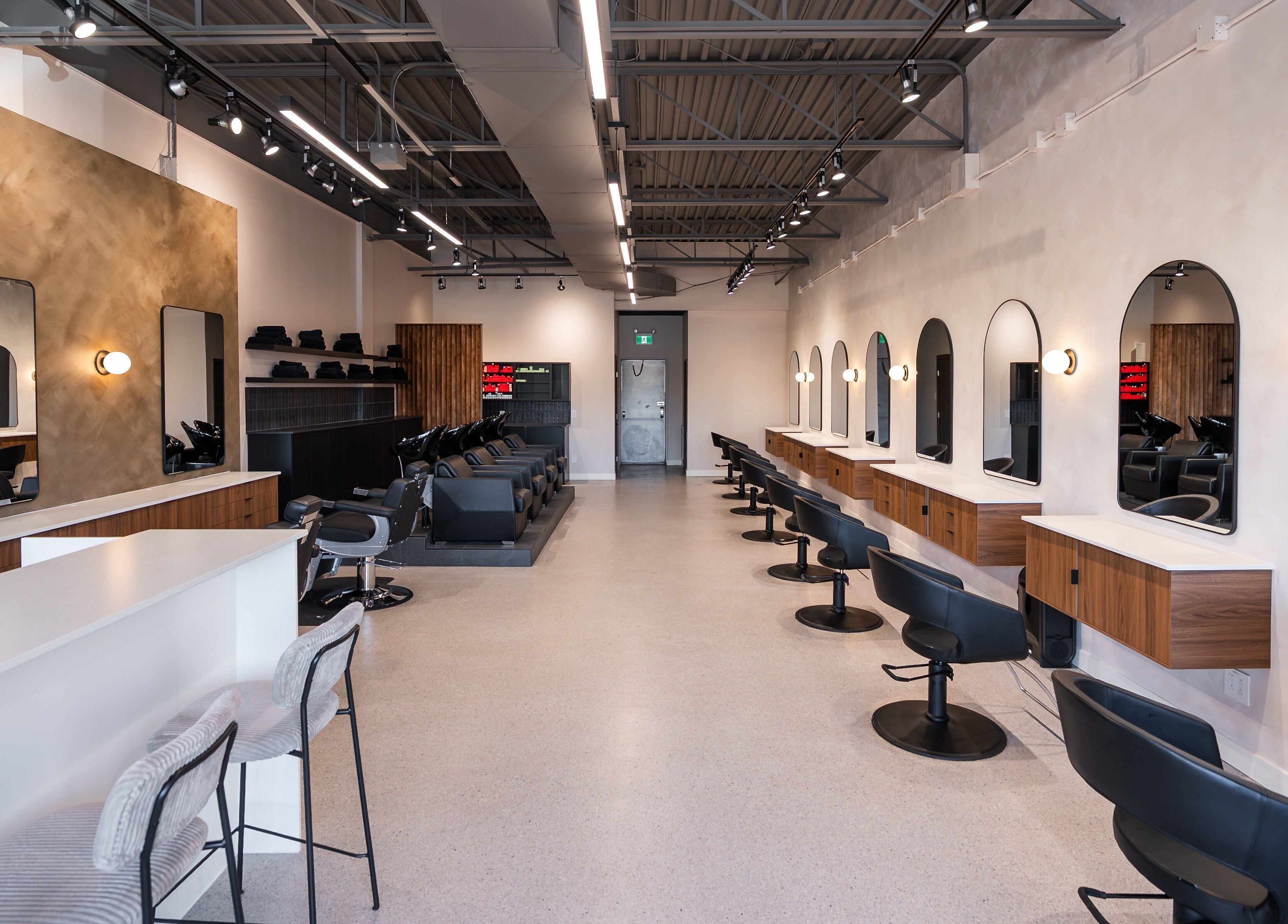 Modern styling stations inside In The Cut Salon, Montréal, Québec, CA, providing luxury hair services.