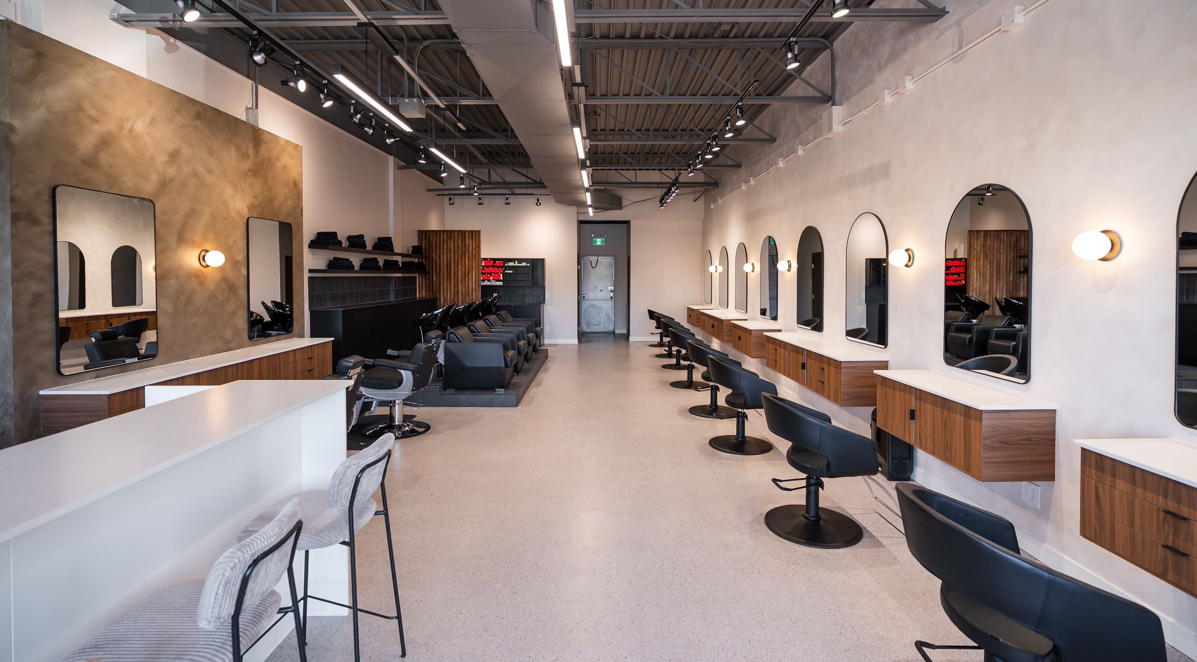 Modern styling stations inside In The Cut Salon, Montréal, Québec, CA, providing luxury hair services.