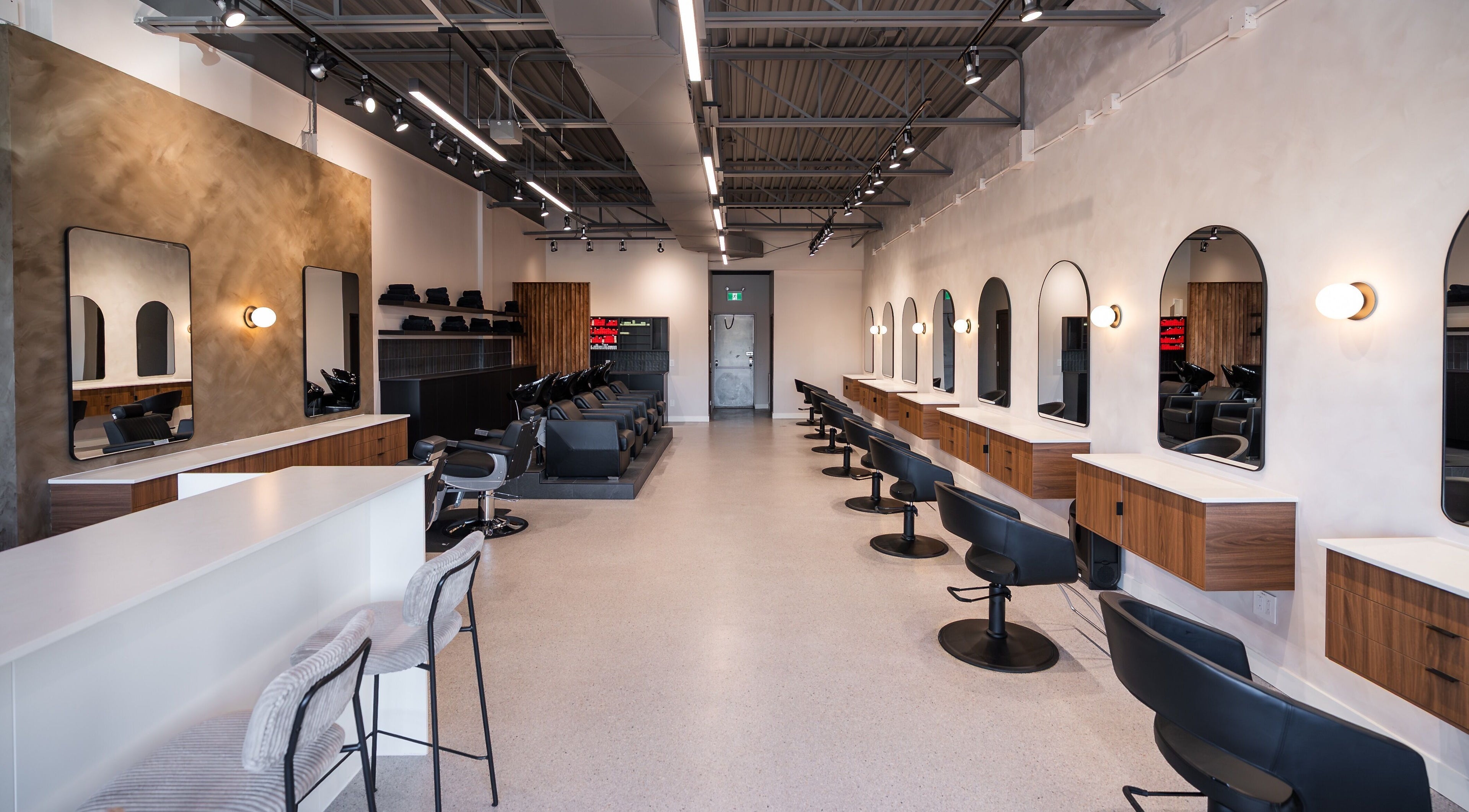 Modern styling stations inside In The Cut Salon, Montréal, Québec, CA, providing luxury hair services.