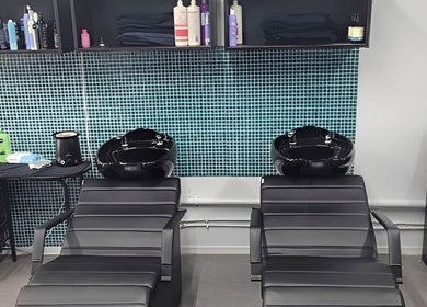 Modern salon wash station at Bring It On Hair, Bellmere, Queensland, AU, featuring sleek design and high-end products.