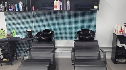 Modern salon wash station at Bring It On Hair, Bellmere, Queensland, AU, featuring sleek design and high-end products.