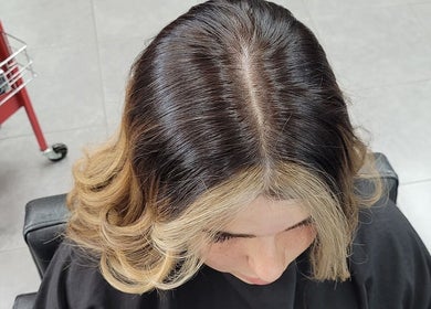 Chic hairstyle with highlighted curls at Bring It On Hair, Bellmere, Queensland, AU.