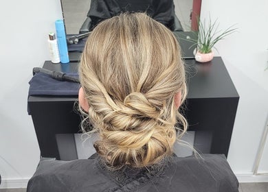 Stylish updo at Bring It On Hair in Bellmere, Queensland, AU, showcasing elegant hair styling.