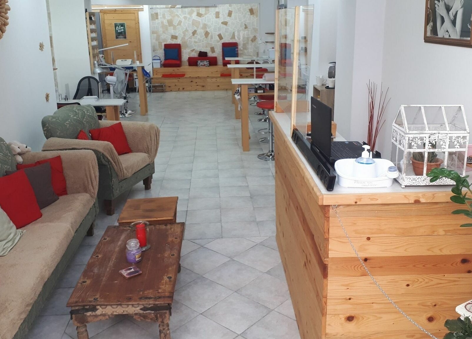 Inviting interior of Lucie's Nails and Beauty in Tas-Sliema, MT with comfortable seating and chic decor.