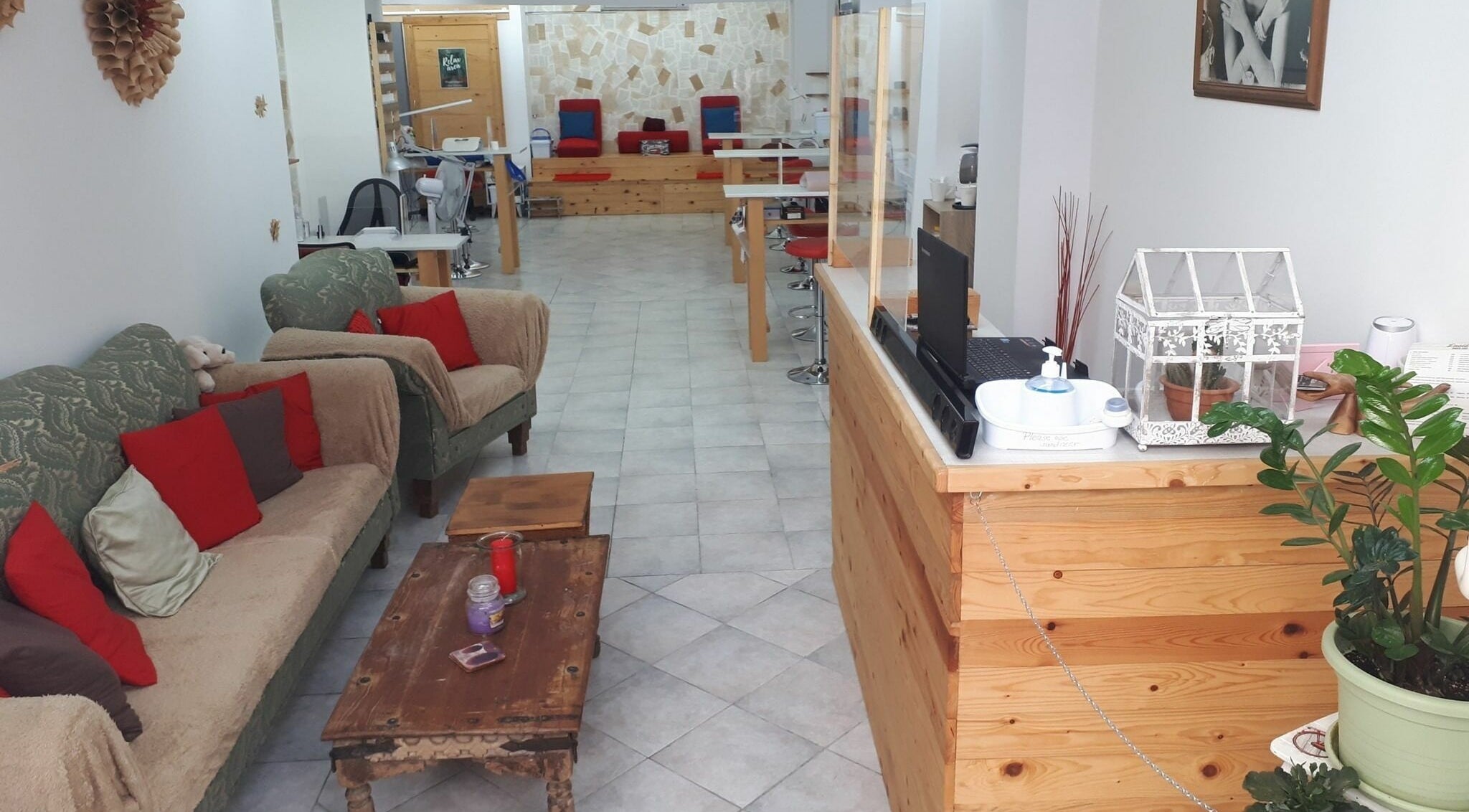 Inviting interior of Lucie's Nails and Beauty in Tas-Sliema, MT with comfortable seating and chic decor.