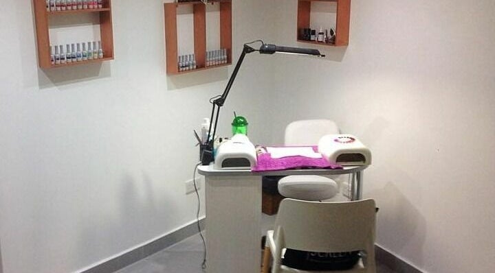 Cozy nail station at Lucie's Nails and Beauty in Tas-Sliema, MT with manicure equipment and polish display.