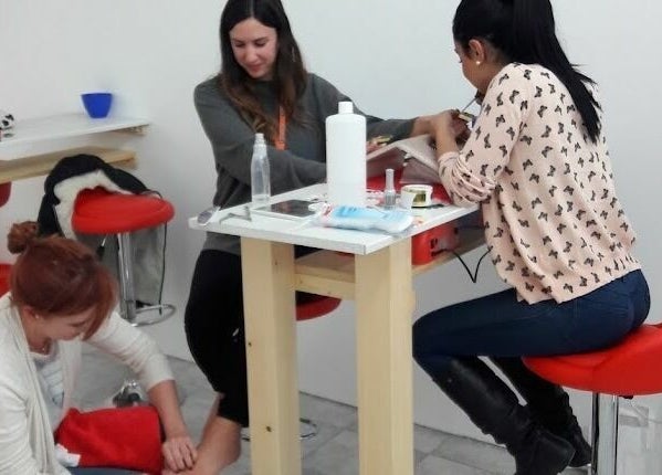 Clients enjoy services at Lucie's Nails and Beauty, Tas-Sliema, MT, showcasing a vibrant and welcoming space.