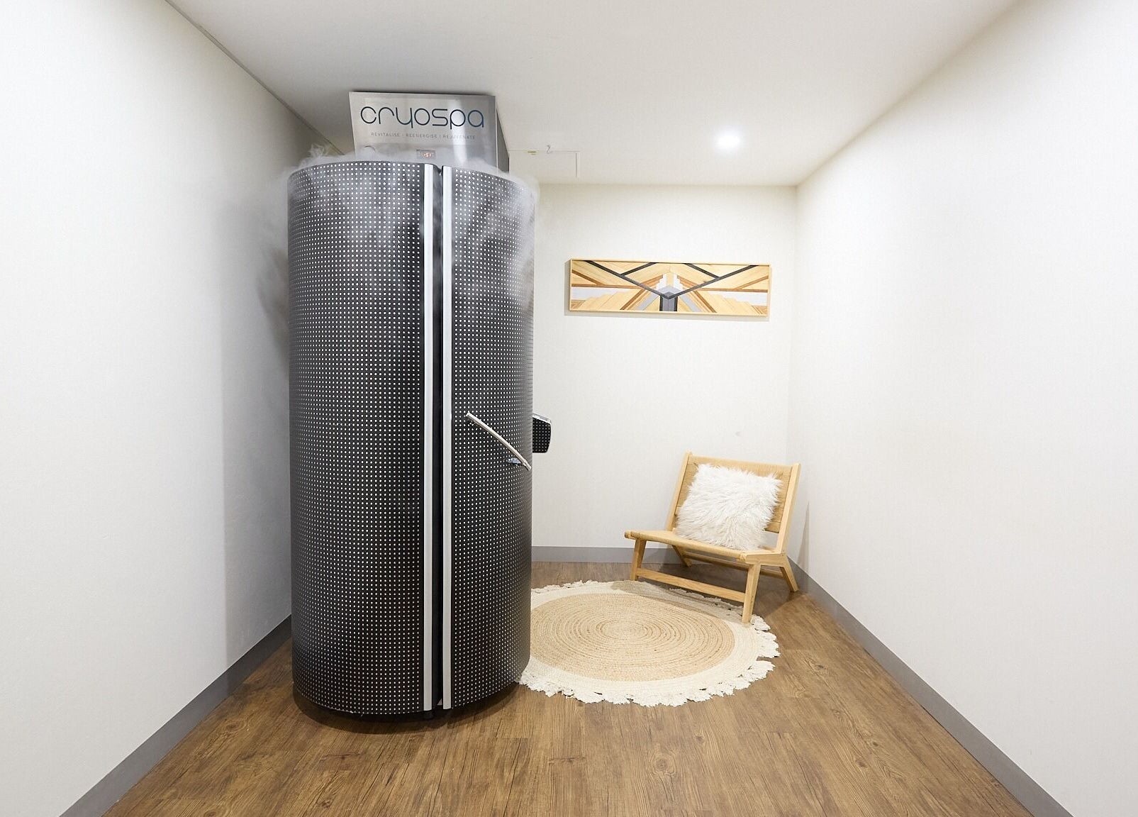 Cryotherapy chamber at Cryospa Clinics in Crows Nest, New South Wales, AU with a cozy seating area.