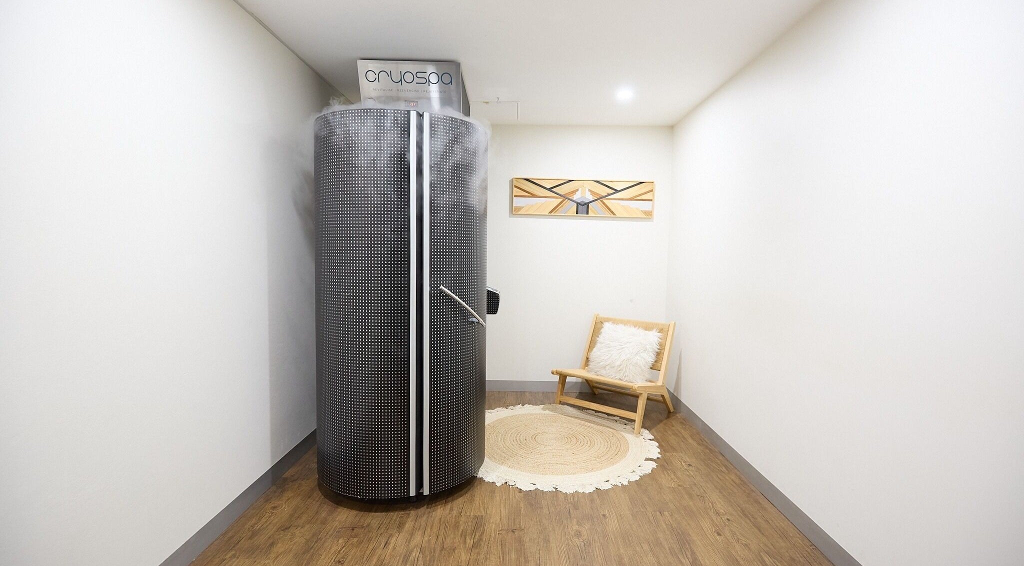 Cryotherapy chamber at Cryospa Clinics in Crows Nest, New South Wales, AU with a cozy seating area.