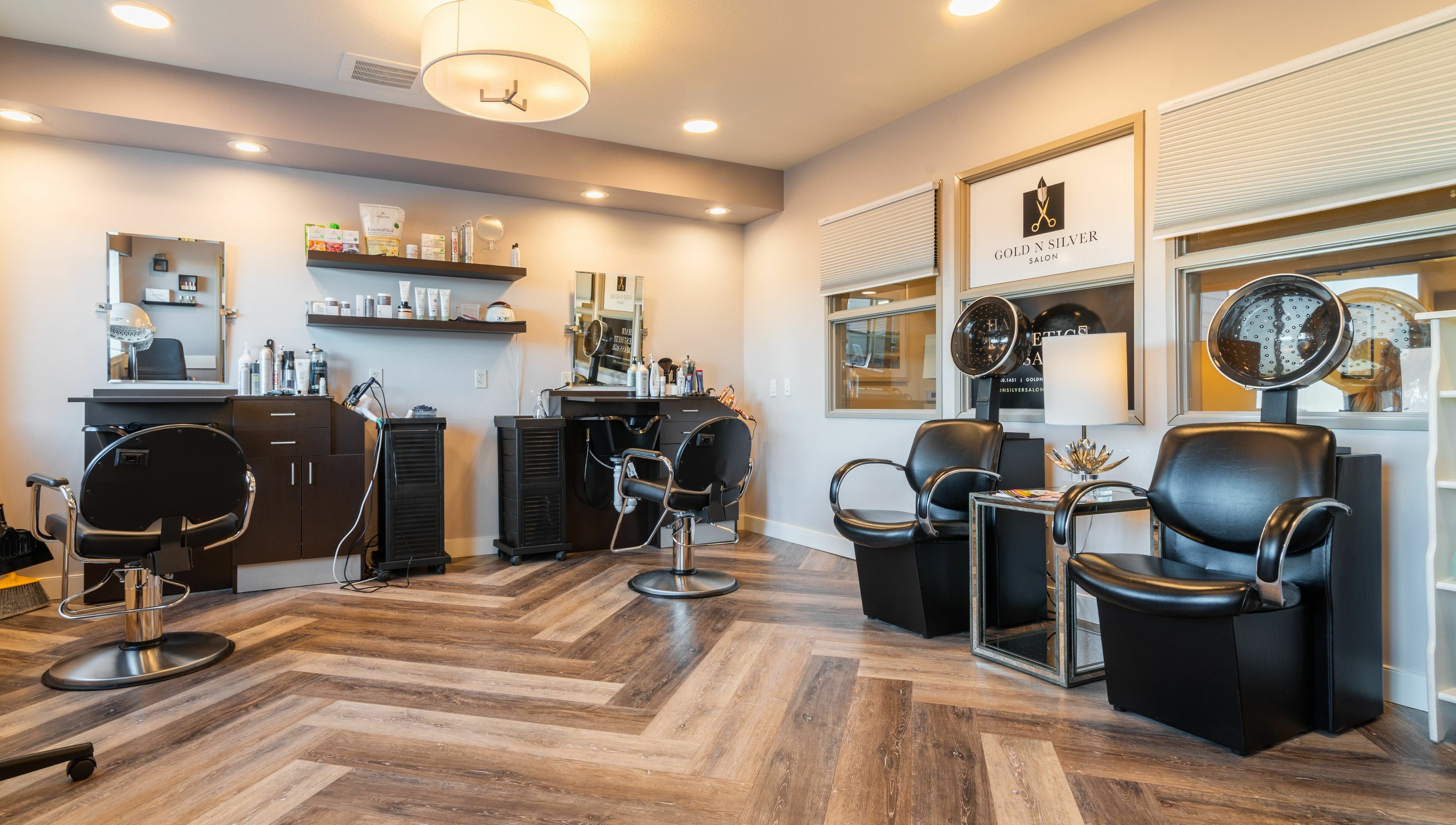 Modern interior of Gold n Silver Salon in Regina, Saskatchewan, CA with stylish chairs and equipment.