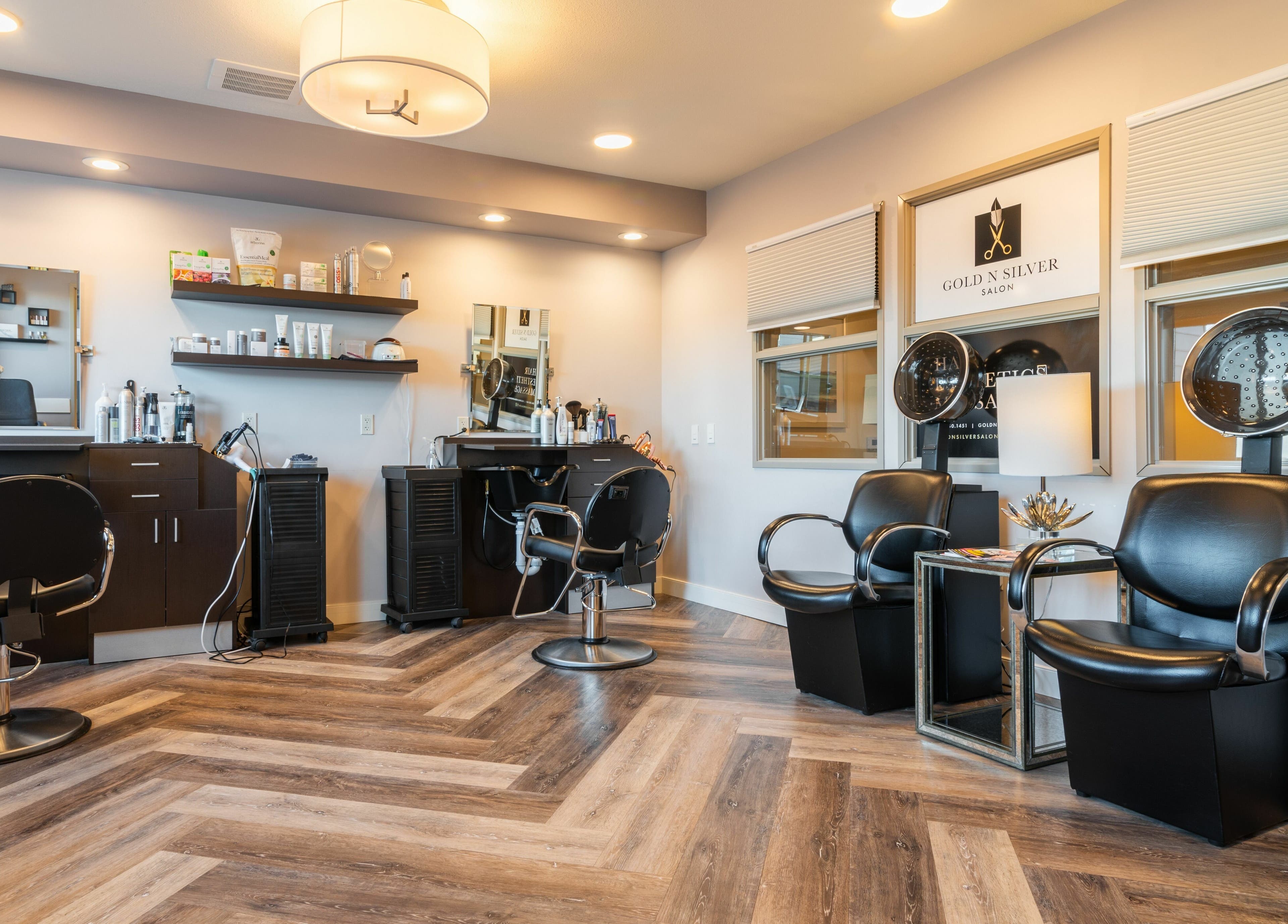 Modern interior of Gold n Silver Salon in Regina, Saskatchewan, CA with stylish chairs and equipment.