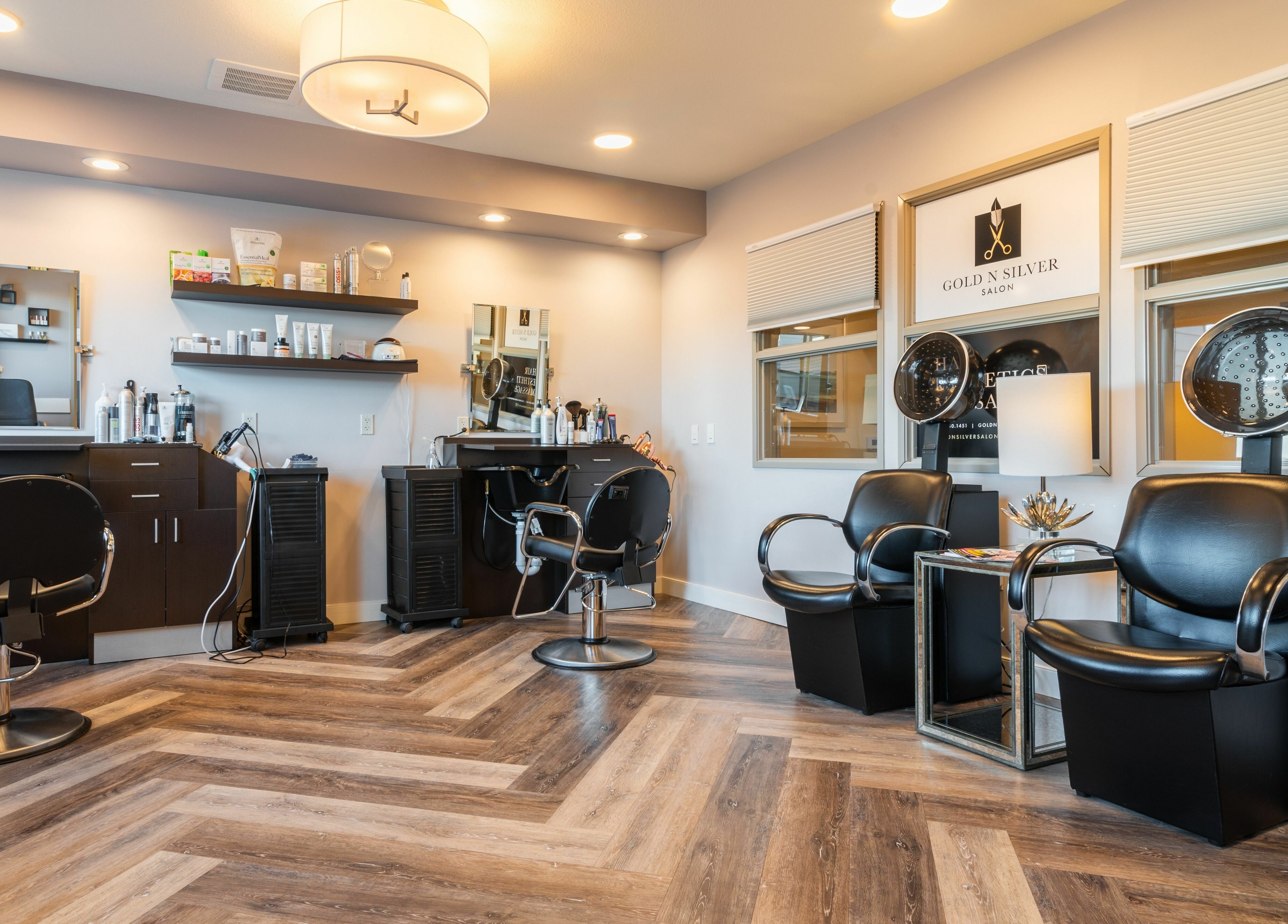 Modern interior of Gold n Silver Salon in Regina, Saskatchewan, CA with stylish chairs and equipment.