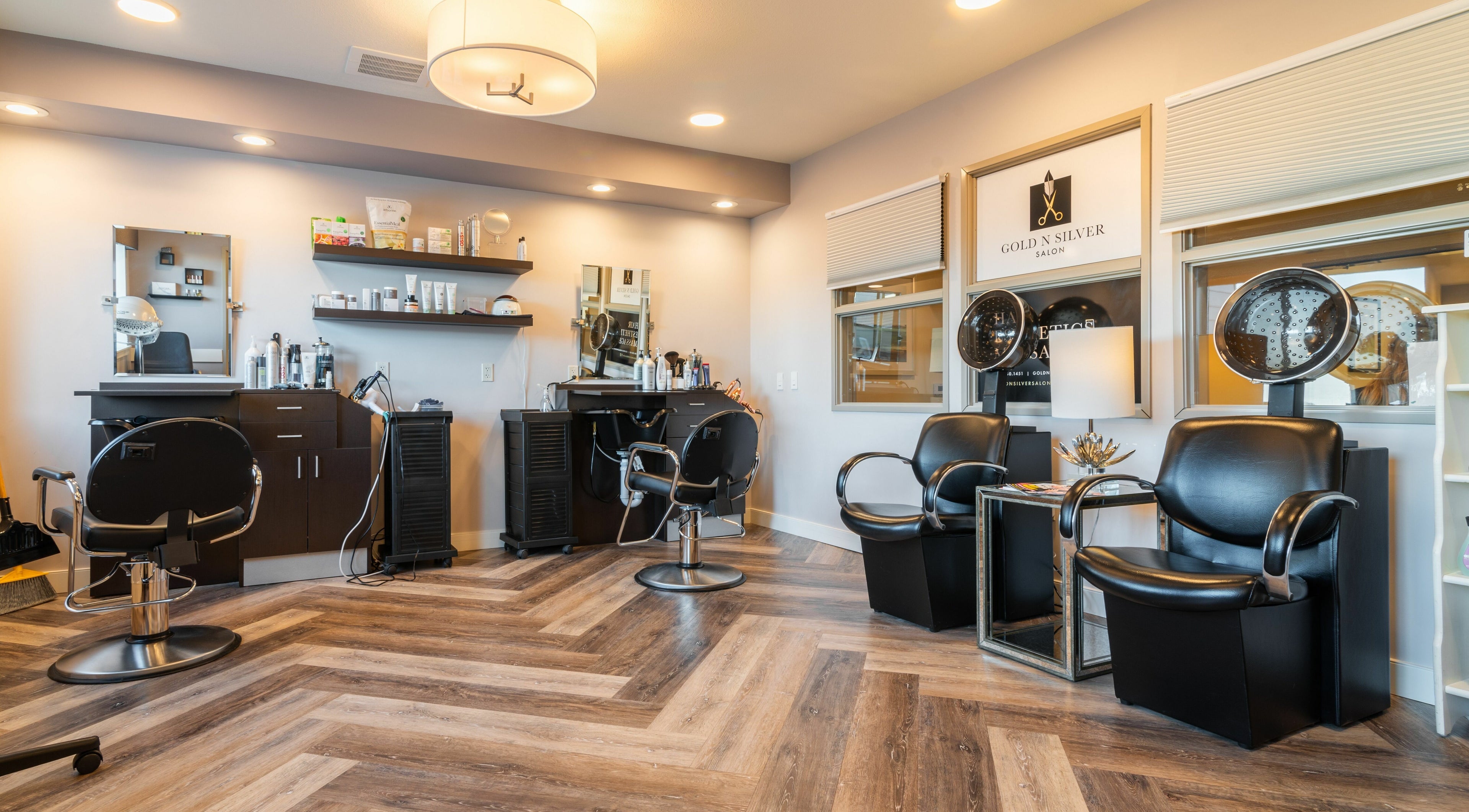 Modern interior of Gold n Silver Salon in Regina, Saskatchewan, CA with stylish chairs and equipment.