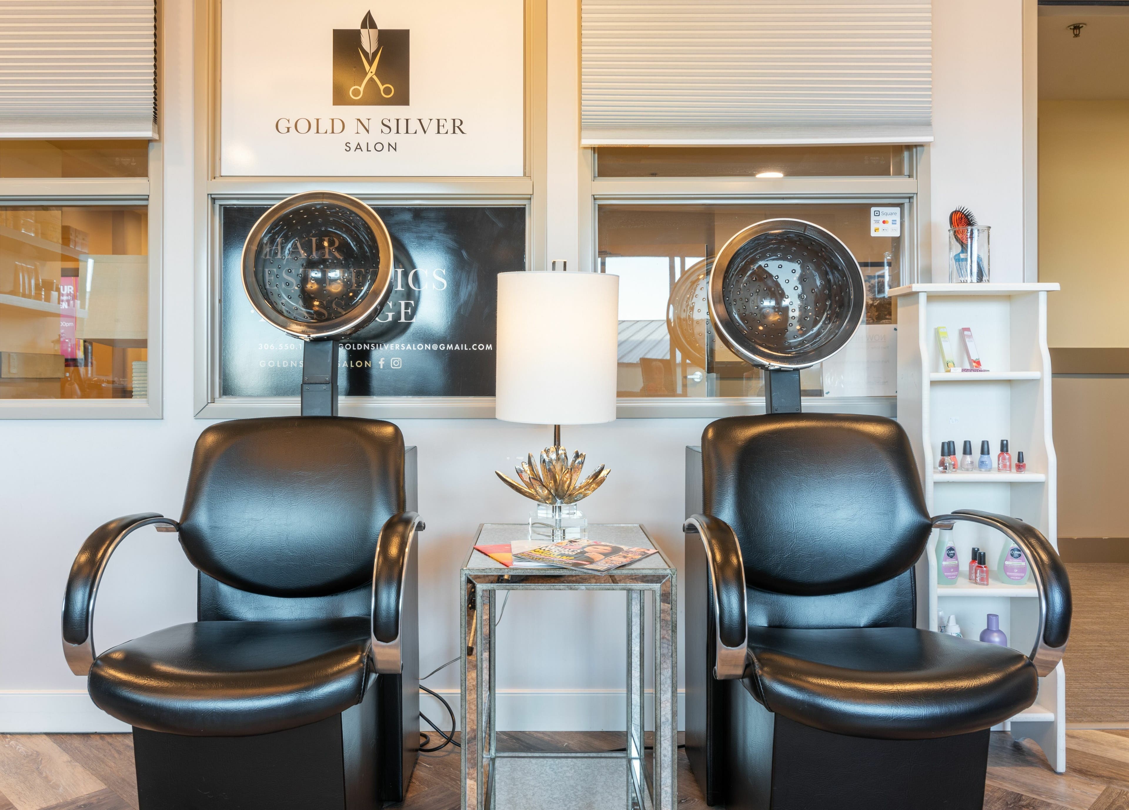Elegant salon seating area at Gold n Silver Salon, Regina, Saskatchewan, CA, showcasing drying chairs and decor.