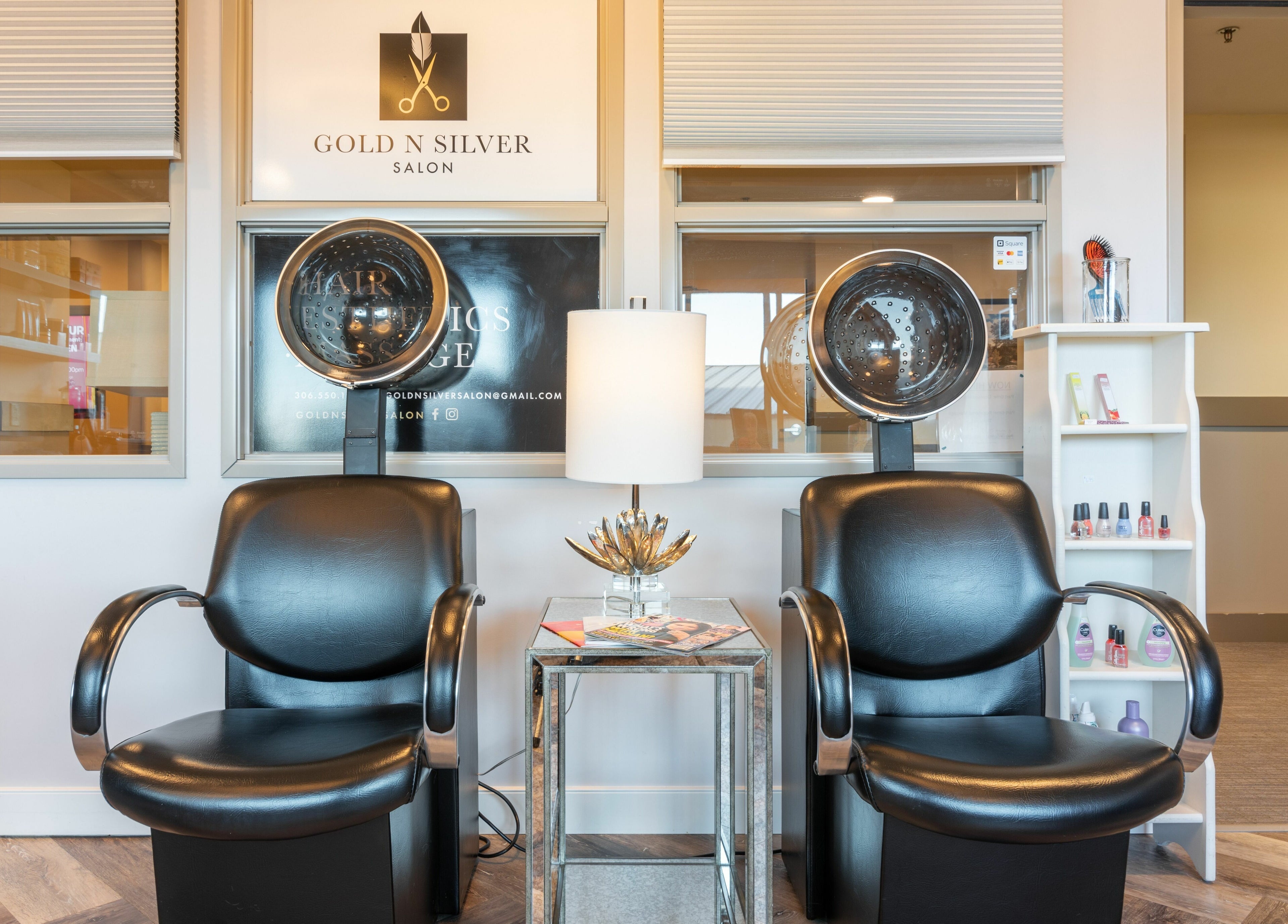 Elegant salon seating area at Gold n Silver Salon, Regina, Saskatchewan, CA, showcasing drying chairs and decor.