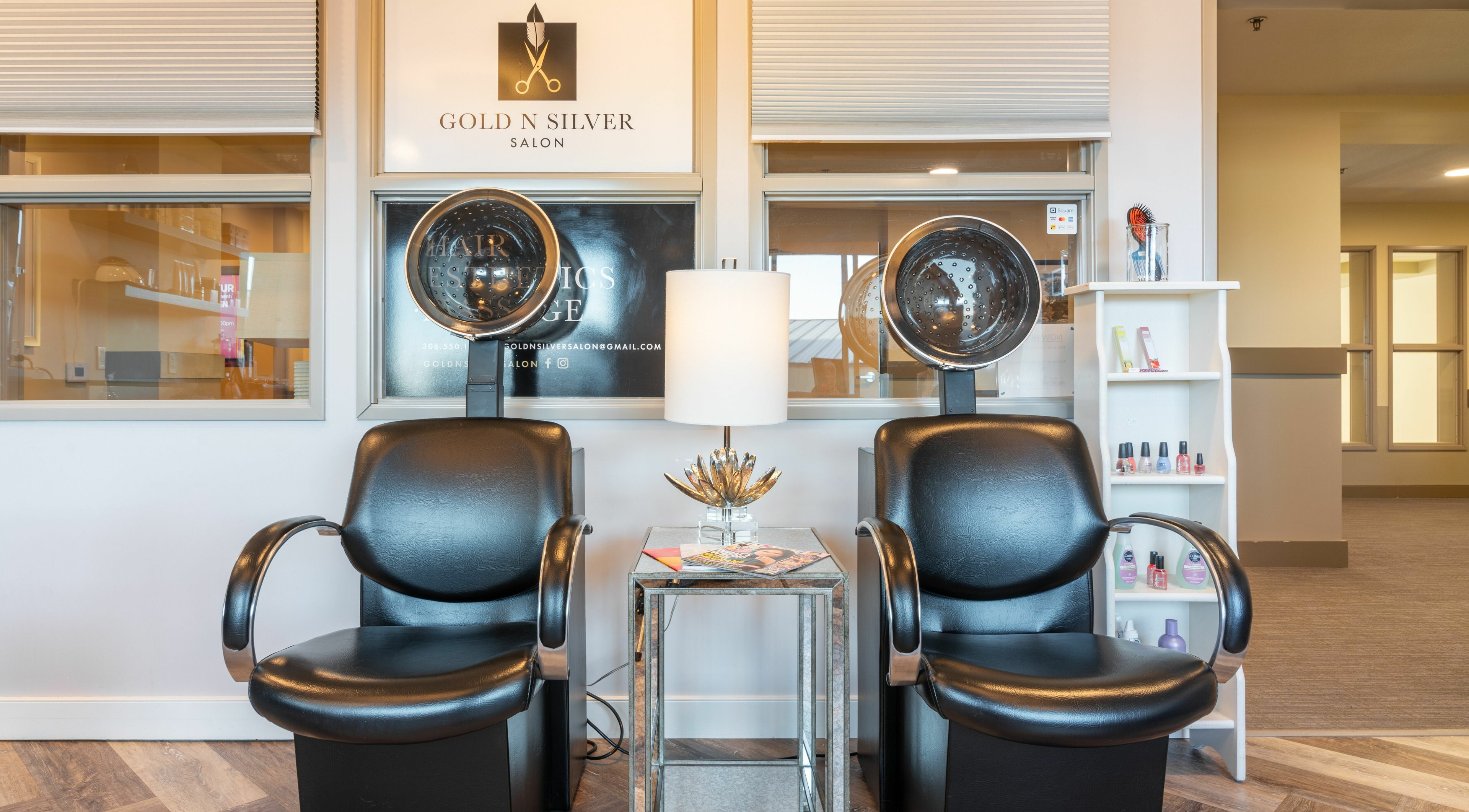 Elegant salon seating area at Gold n Silver Salon, Regina, Saskatchewan, CA, showcasing drying chairs and decor.