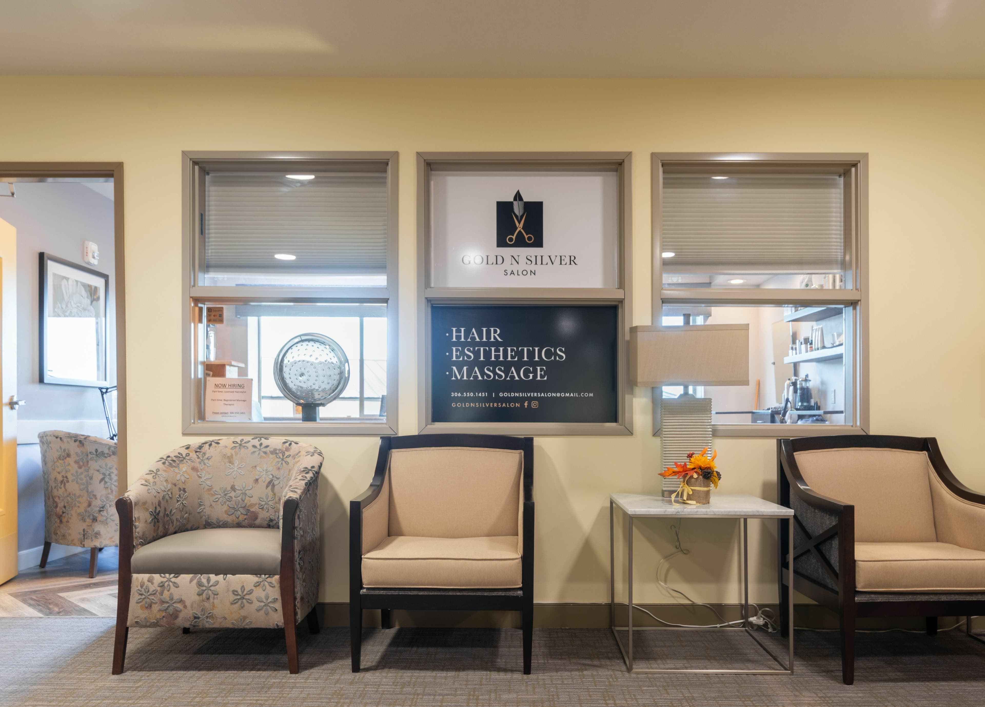 Cozy reception area at Gold n Silver Salon, Regina, Saskatchewan, CA featuring elegant seating and decor.