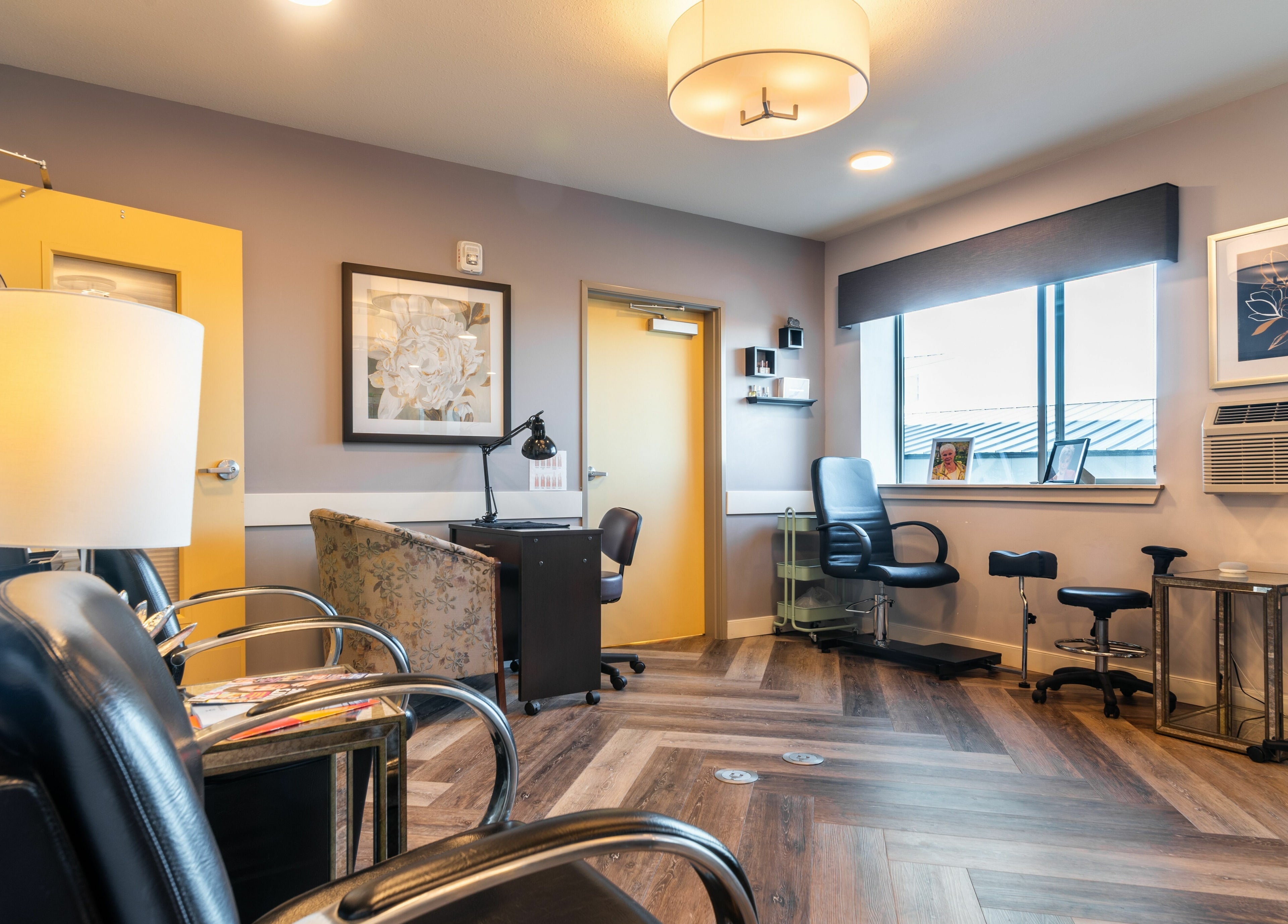 Stylish and cozy interior of Gold n Silver Salon in Regina, Saskatchewan, CA with modern seating and decor.