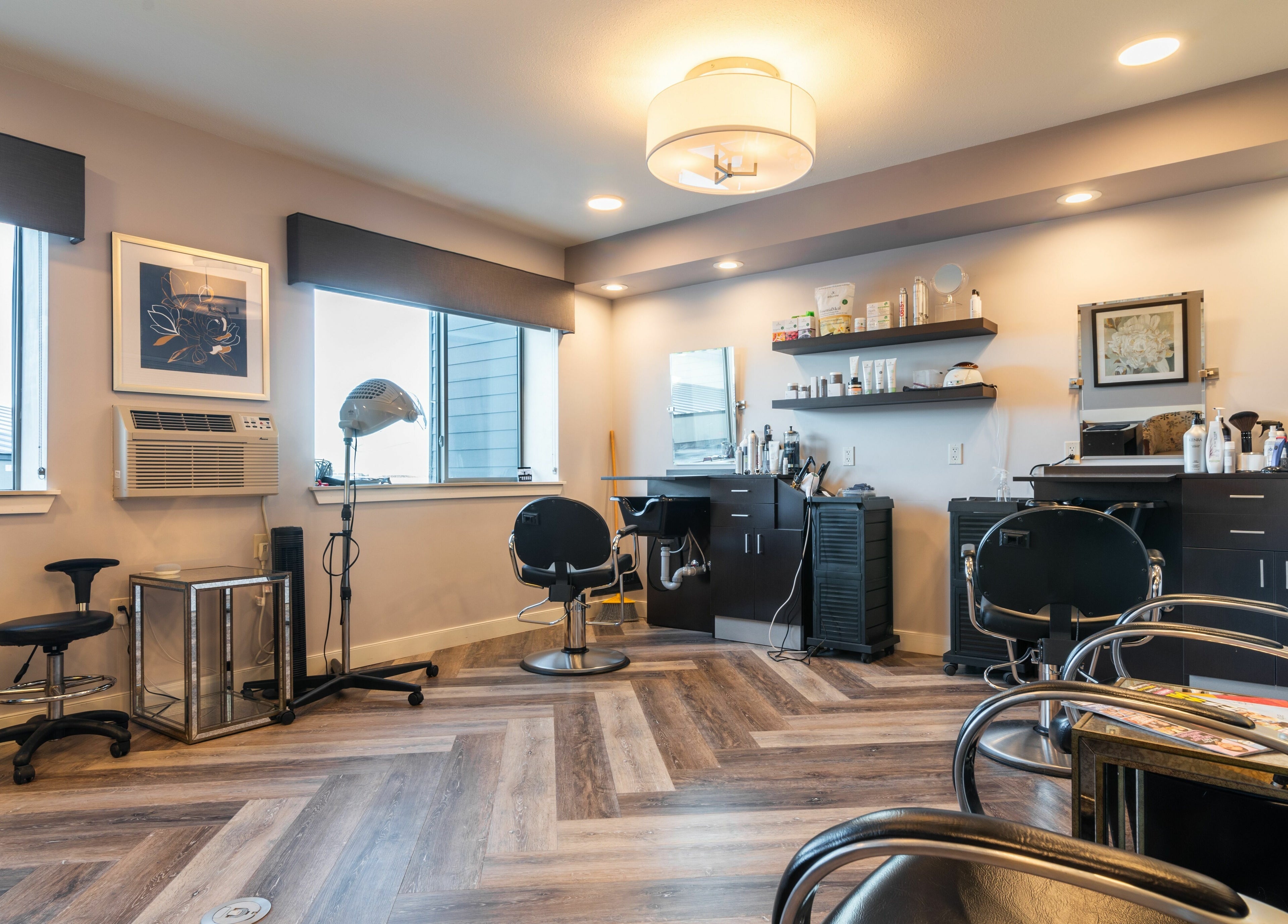 Modern salon interior at Gold n Silver Salon, Regina, Saskatchewan, CA featuring stylish chairs and beauty stations.