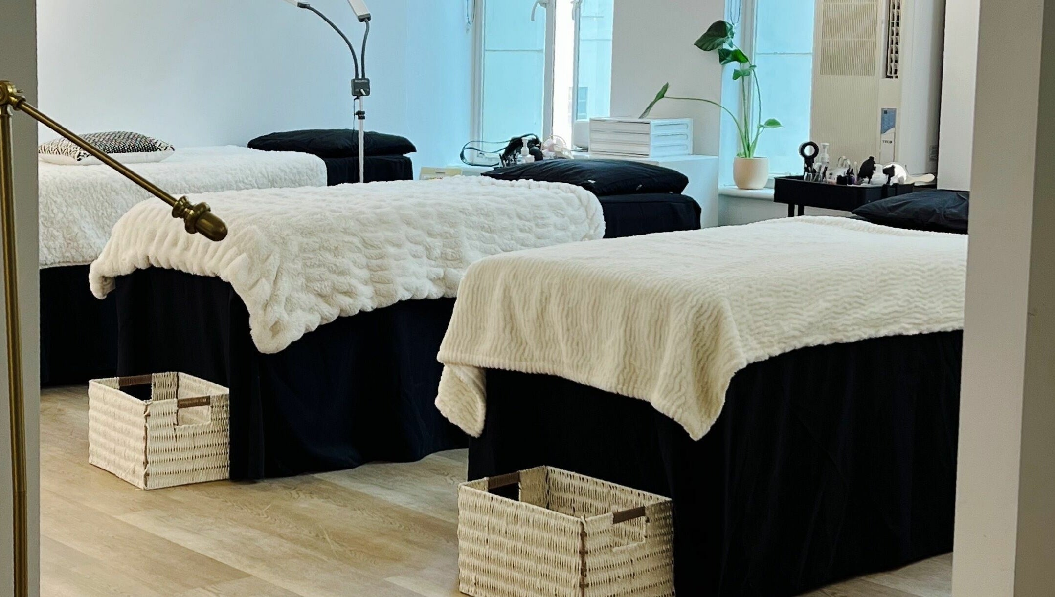 Cozy treatment room at Beauty Moah, Melbourne, Victoria, AU with plush beds and elegant decor.