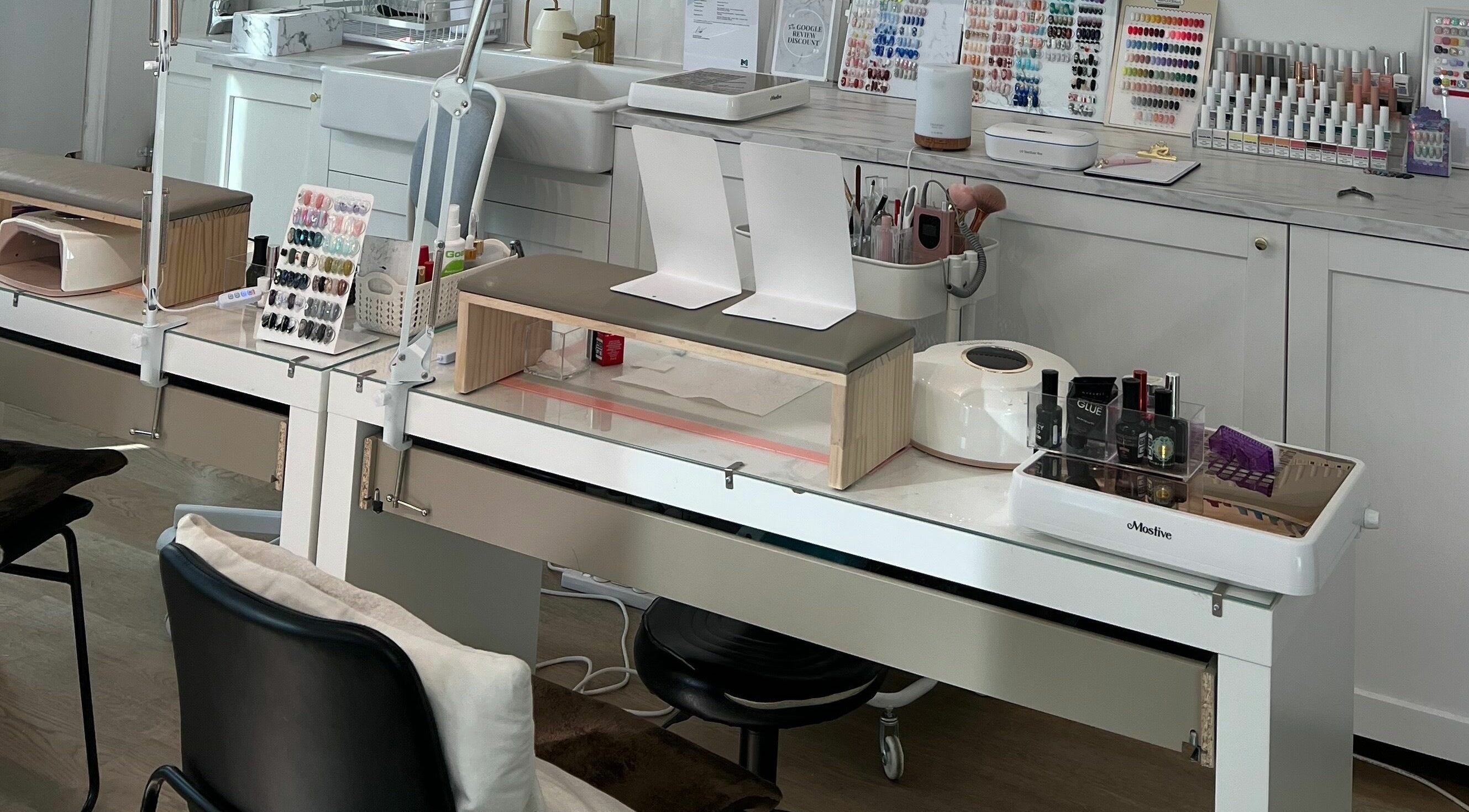 Modern nail station at Beauty Moah in Melbourne, Victoria, AU, showcasing organized polish and tools.