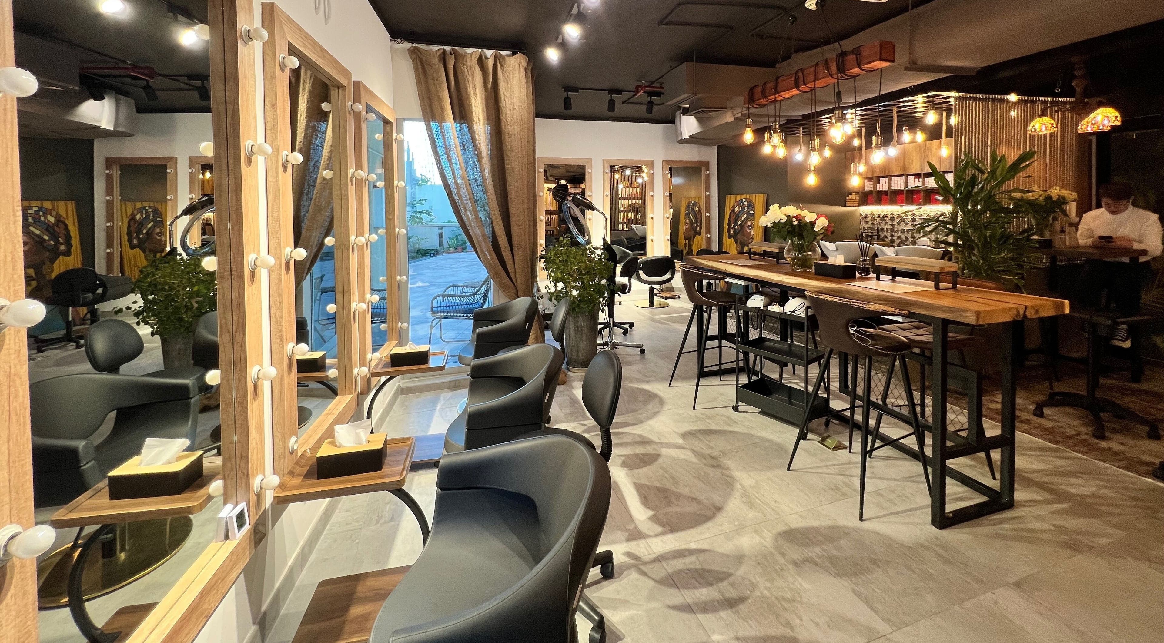 Modern interior of Paulista Beauty Salon in Dubai, Dubai, AE, featuring stylish decor and seating arrangement.