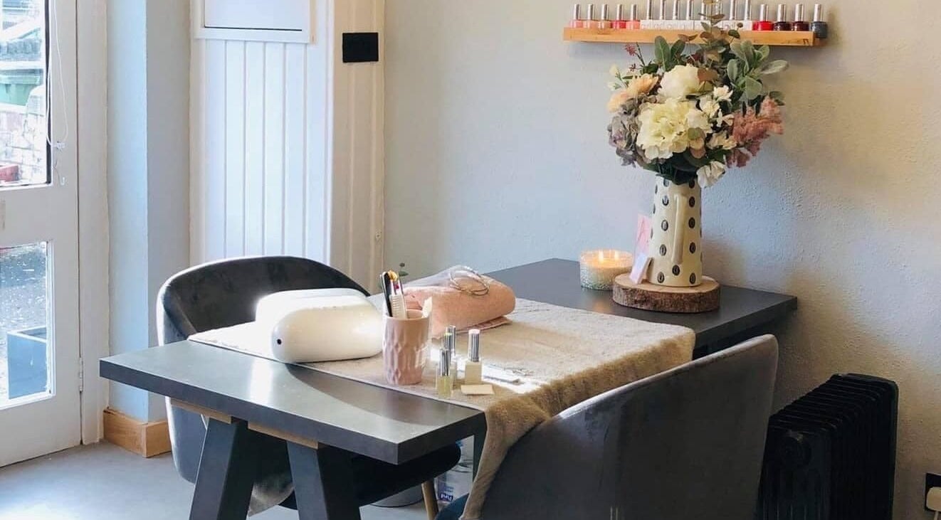 Modern manicure table at Belle Bridal Hair and Beauty - East Lothian in Tranent, Scotland, GB with floral decor.
