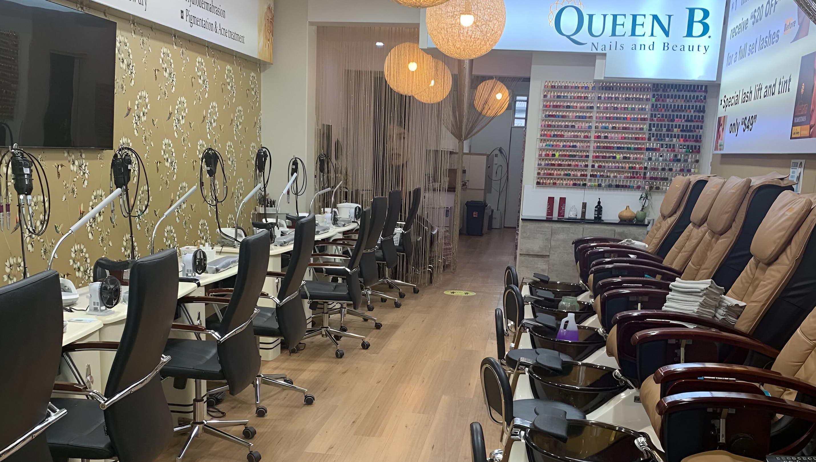 Elegant interior of Queen B Skin and Beauty in Melbourne, Victoria, AU showcasing manicure and pedicure stations.