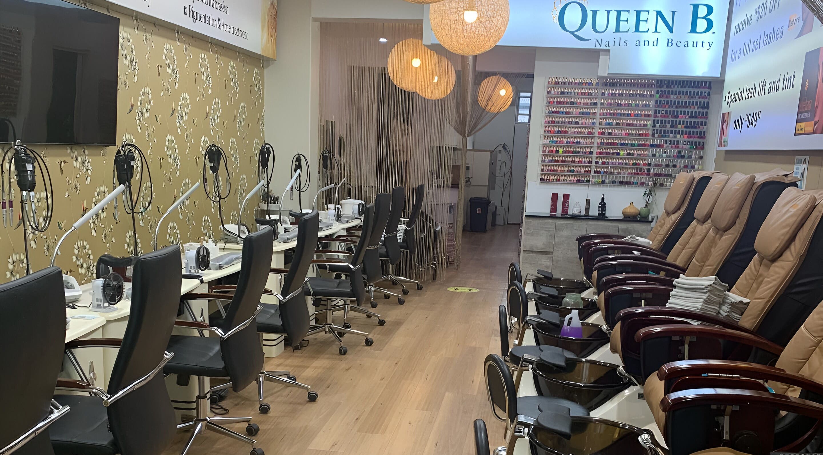 Elegant interior of Queen B Skin and Beauty in Melbourne, Victoria, AU showcasing manicure and pedicure stations.