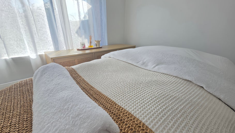 Cozy treatment room at The Siri Beauty & Eyelashes in Busselton, Western Australia, AU, with a plush bed and soft lighting.