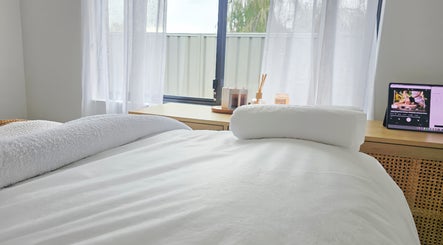 Tranquil treatment room at The Siri Beauty & Eyelashes, Busselton, Western Australia, AU with a cozy massage bed.