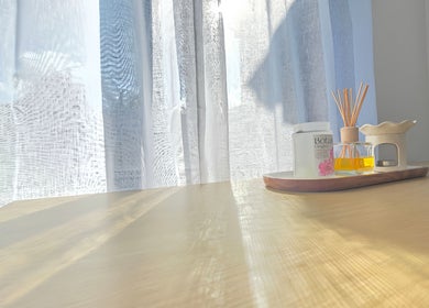 Scented oil and reed diffuser on wooden table at The Siri Beauty & Eyelashes in Busselton, Western Australia, AU.