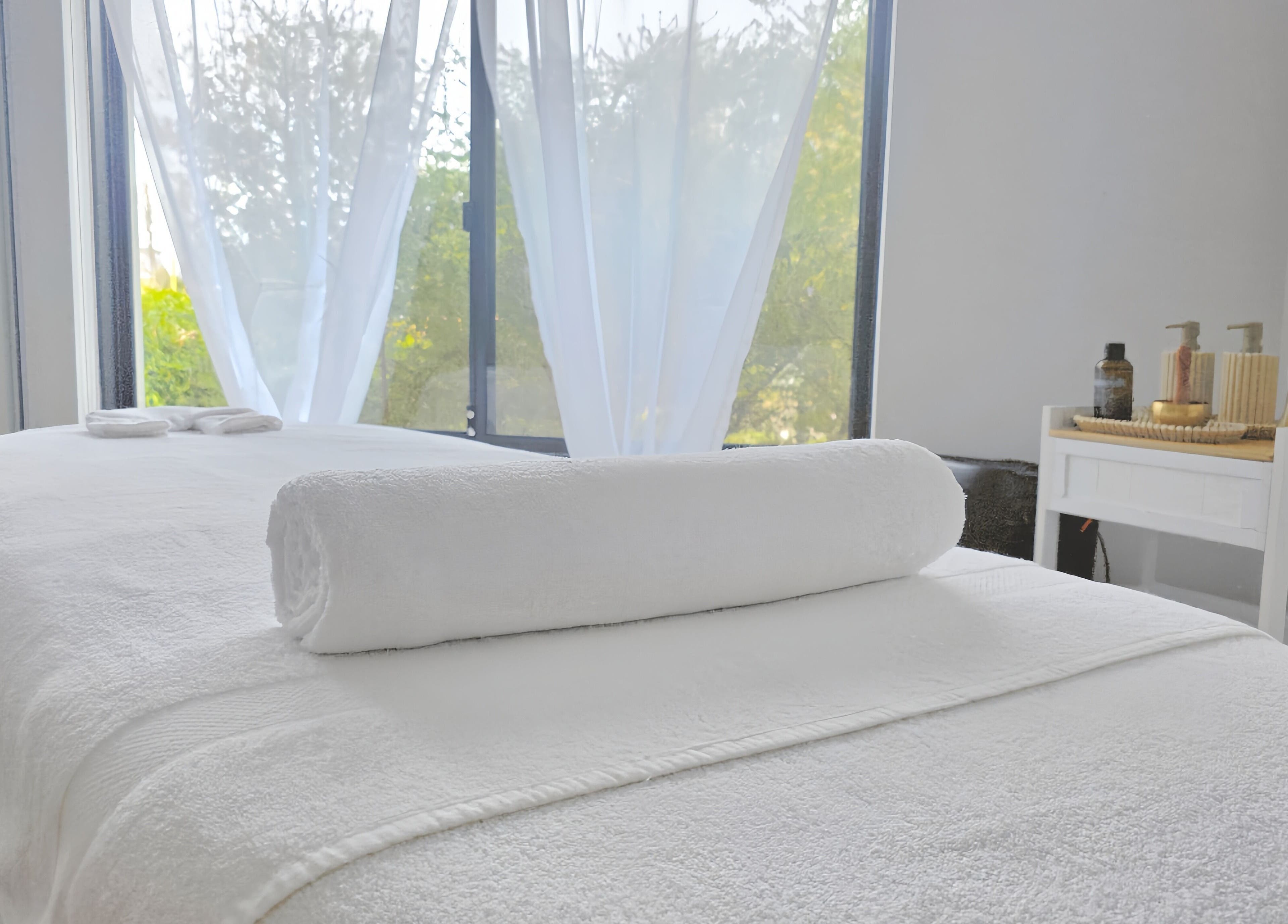 Relaxing massage bed at The Siri Beauty & Eyelashes, Busselton, Western Australia, AU with serene natural light.