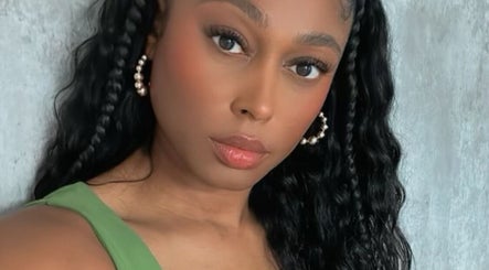 Elegant woman with braided hair at I Am Natorious, Orange Park, Florida, US.