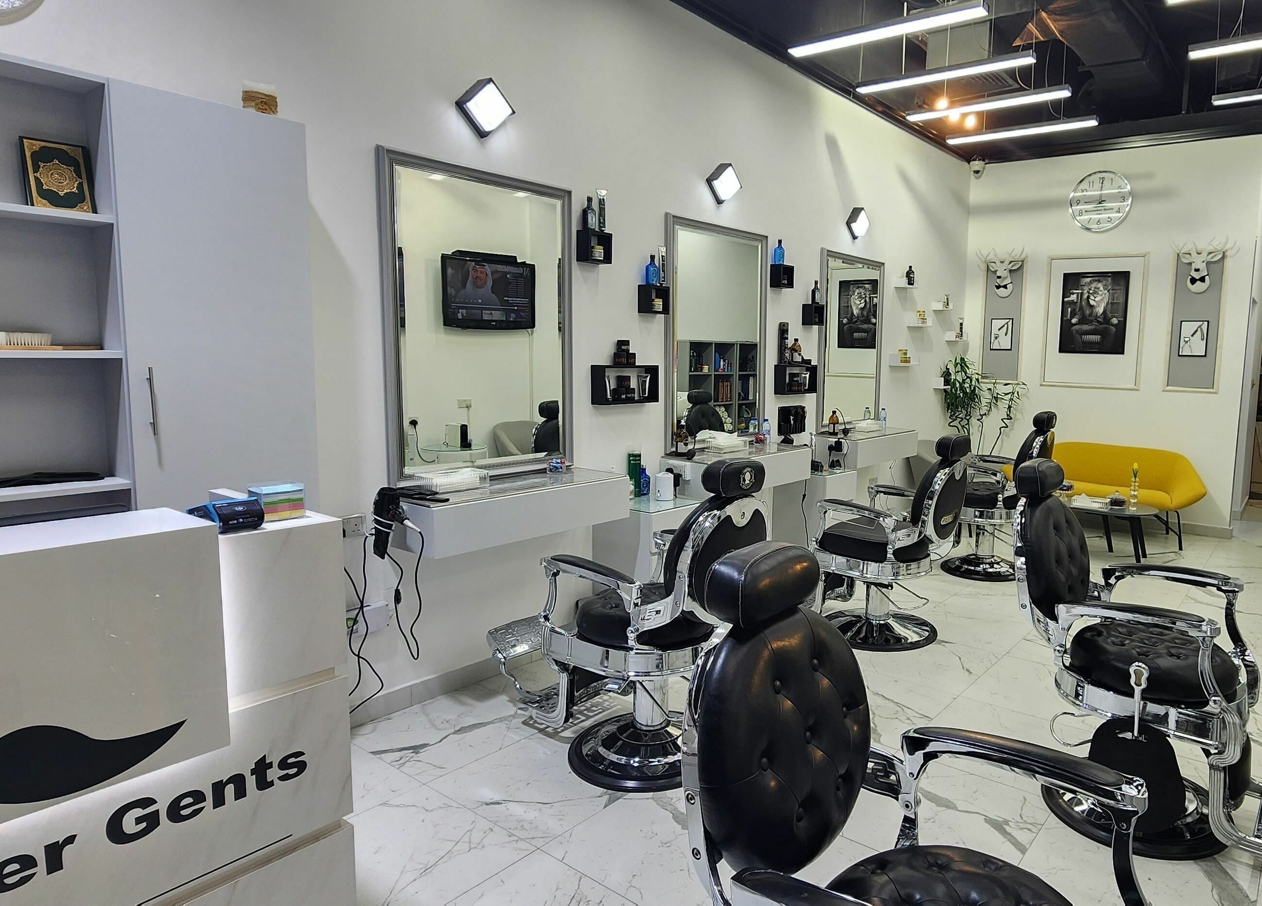Interior of Movember Gents Salon in Dubai, AE featuring modern barber chairs and stylish decor.