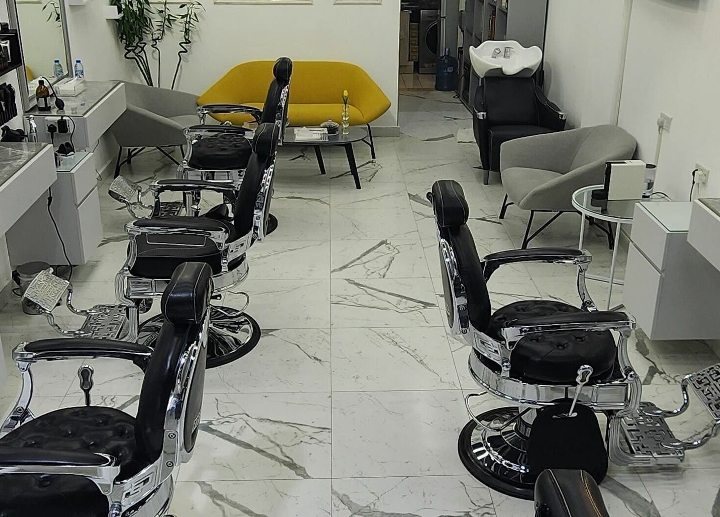 Interior of Movember Gents Salon in Dubai, AE, featuring modern barber chairs and sleek design.