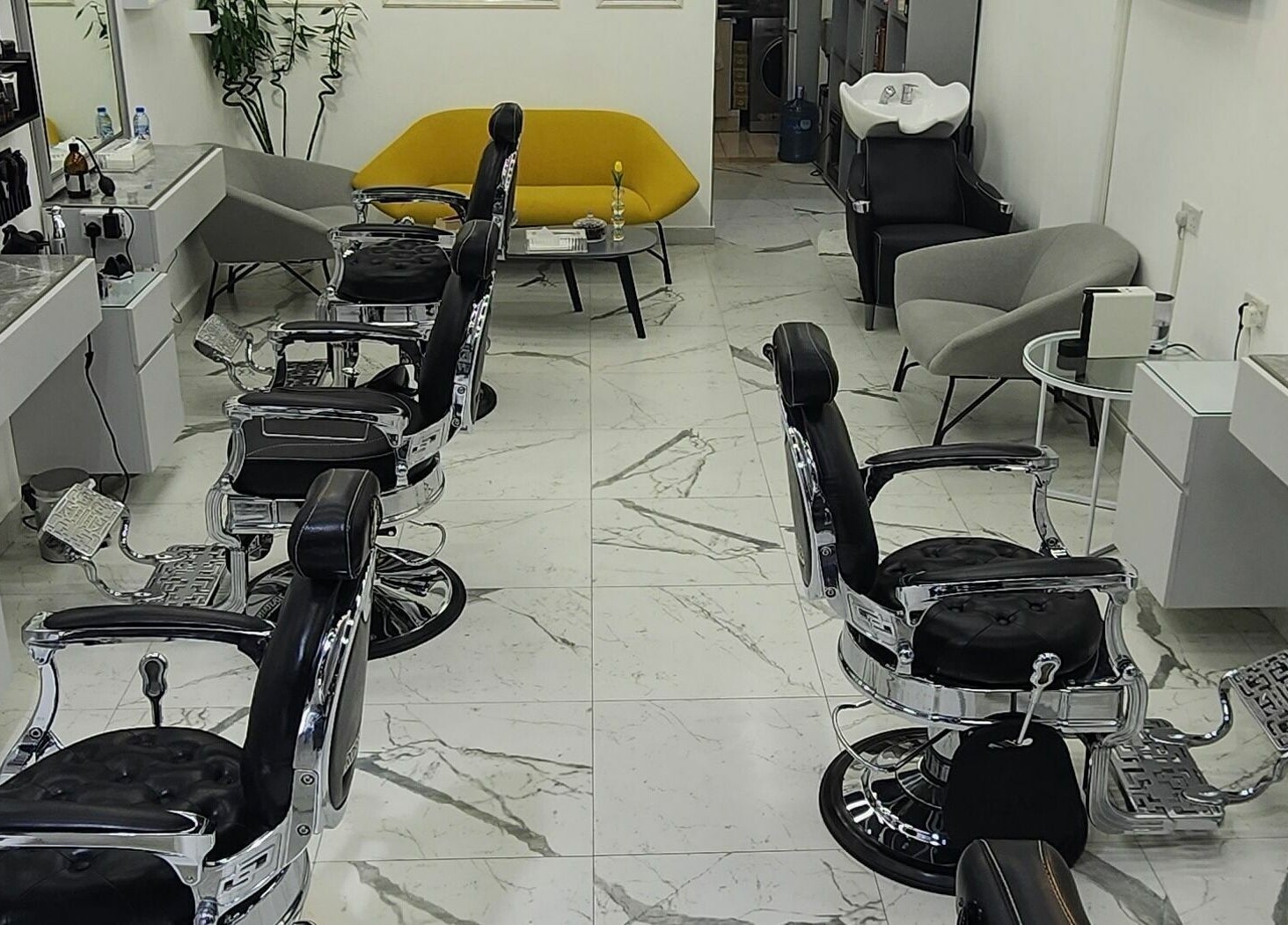 Interior of Movember Gents Salon in Dubai, AE, featuring modern barber chairs and sleek design.